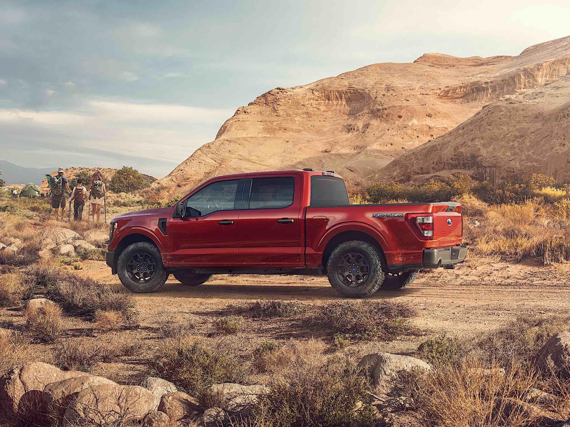 Ford's all-new 2023 F-150 Rattler on a rocky, grassy off-road environment.