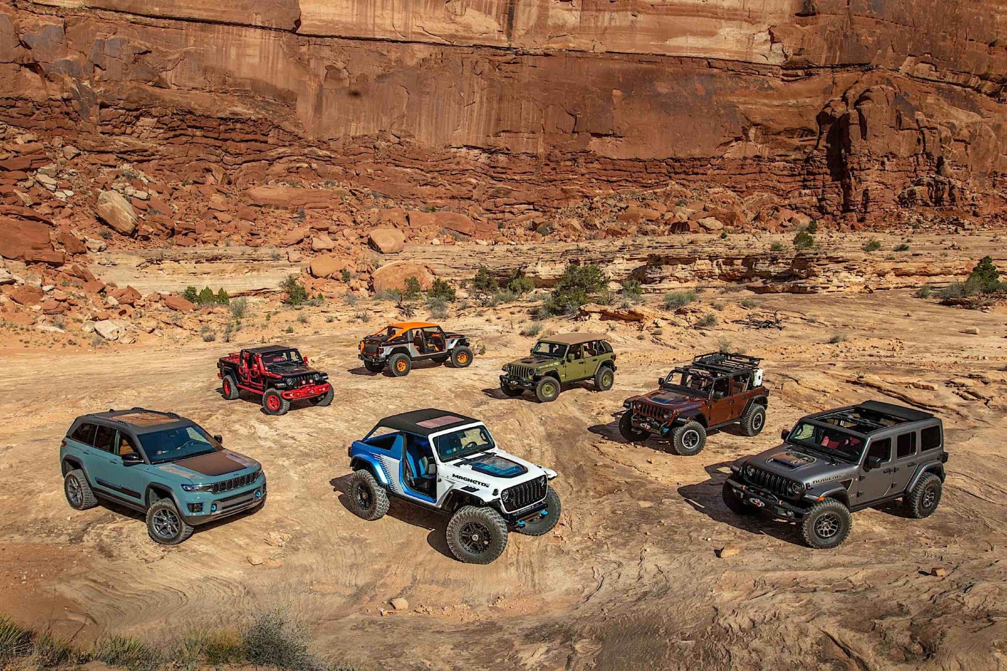 Jeeps parked in a desert landscape.