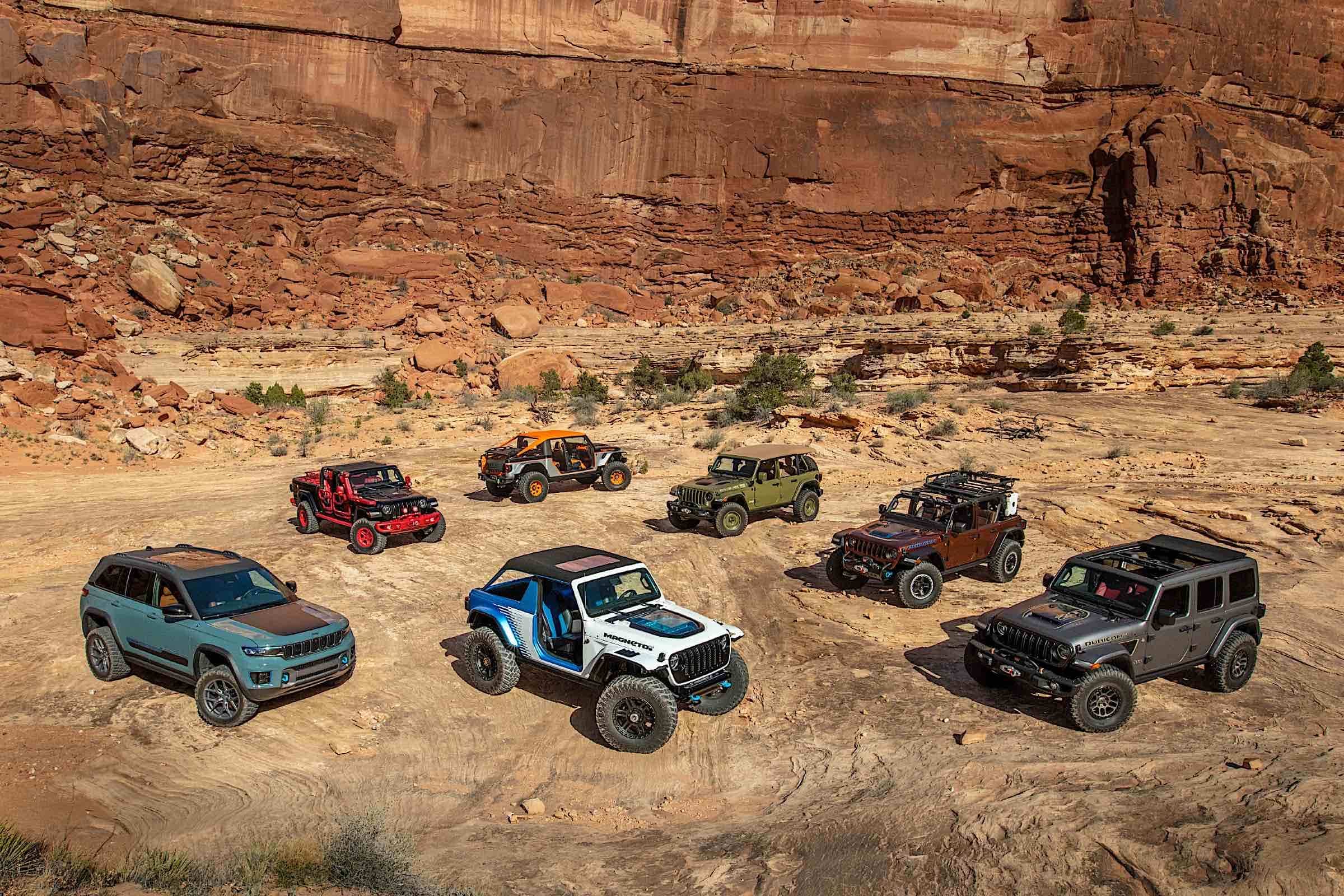 Jeeps parked in a desert landscape.