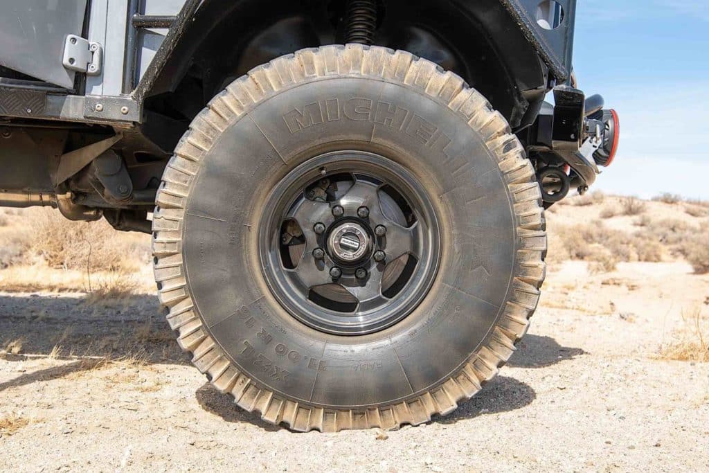 This 1984 Land Rover Defender 110 drives on Michelin XZL 38x11R16 military tires.