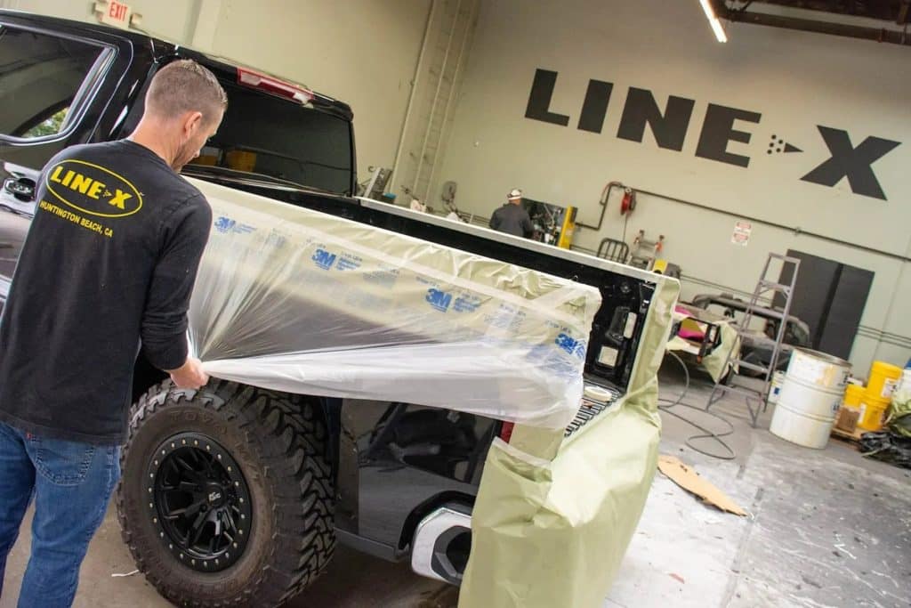 A truck bed coated with A Line-X Bedliner