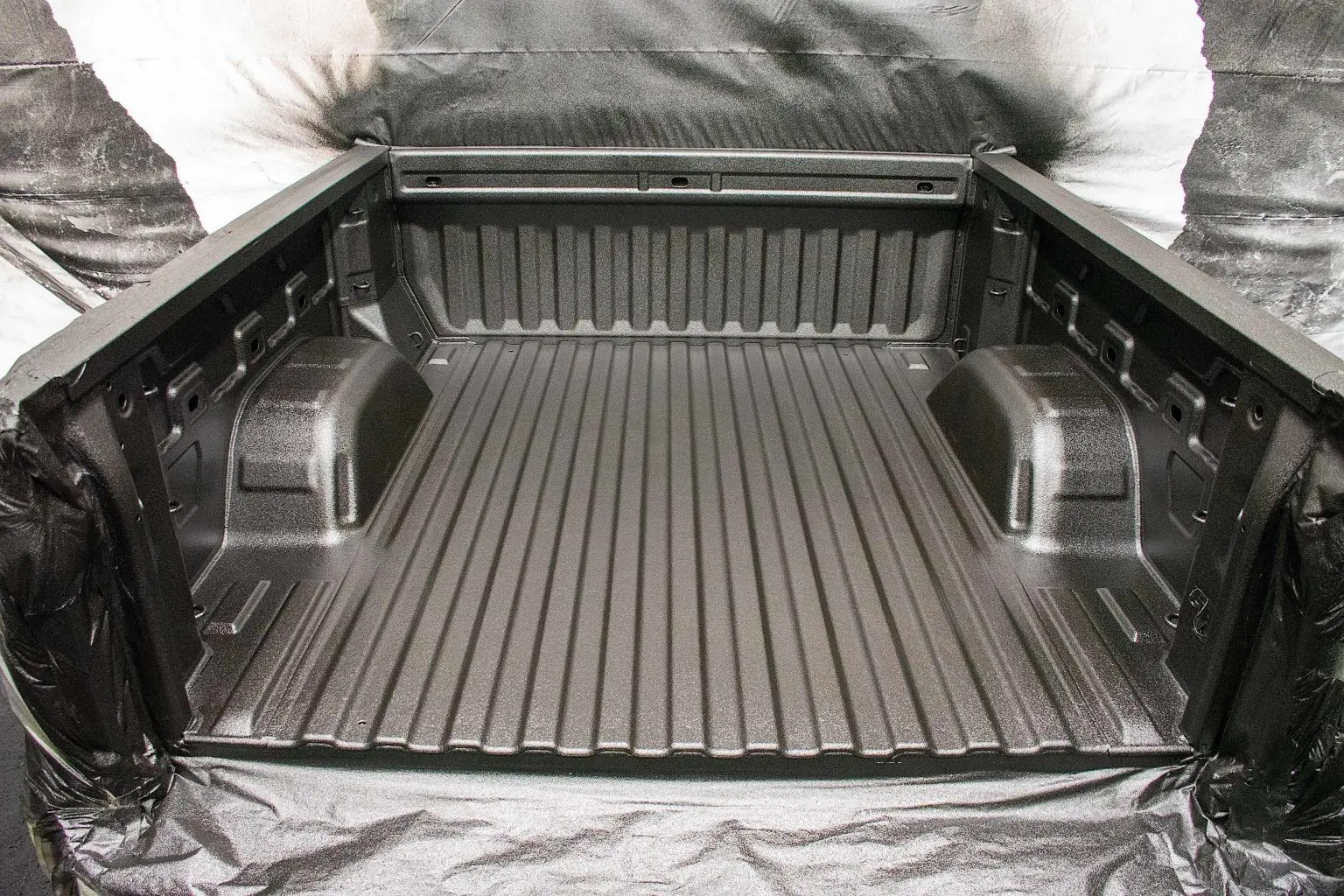 A truck bed coated with A Line-X Bedliner