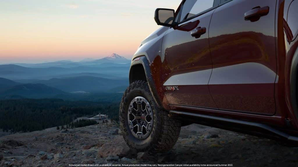 A GMC Coanyon AT4X on a hillside.