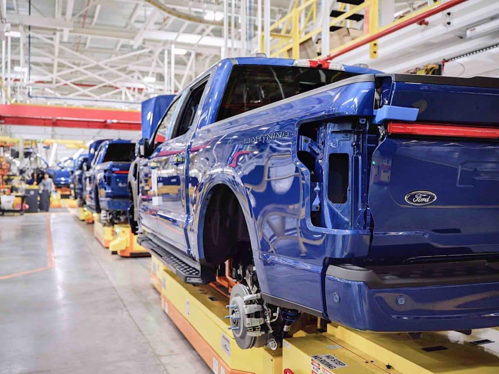 An assembly line creating Ford F-150 Lightning truccks.