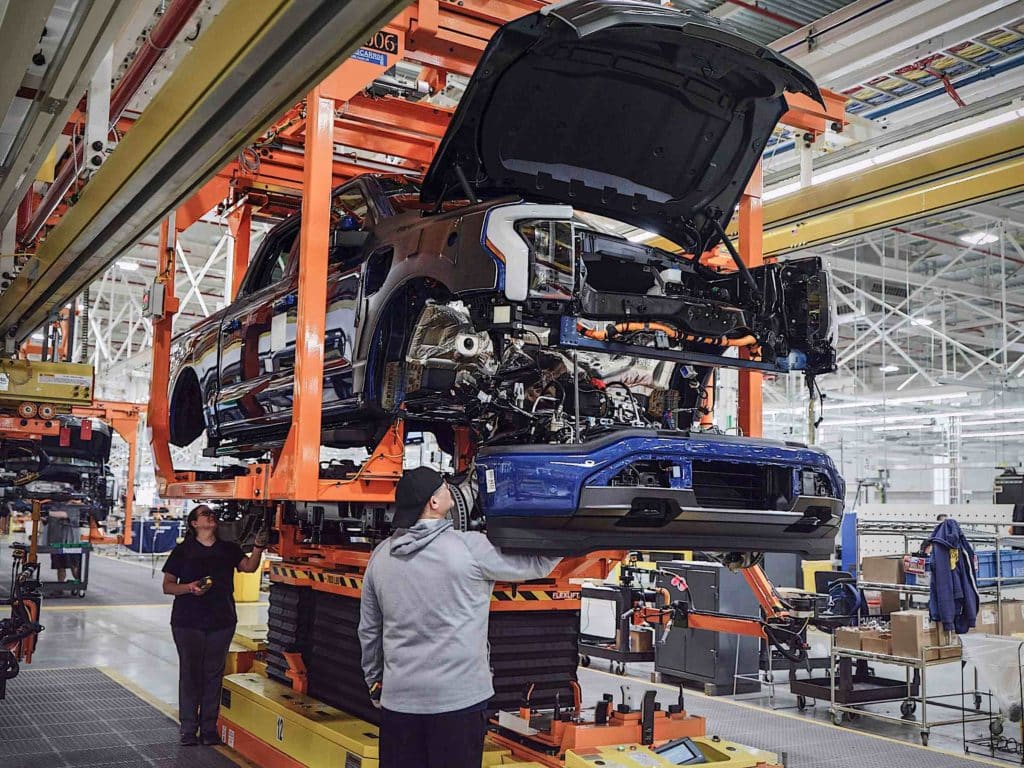 An assembly line creating Ford F-150 Lightning truccks.