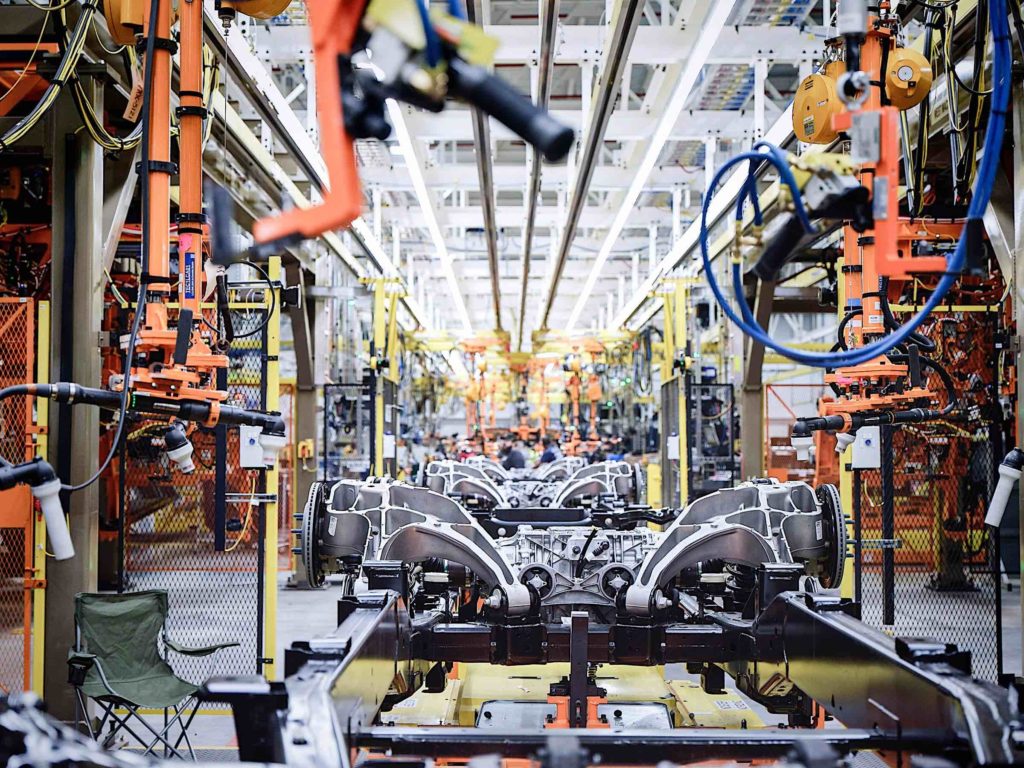 An assembly line creating Ford F-150 Lightning truccks.