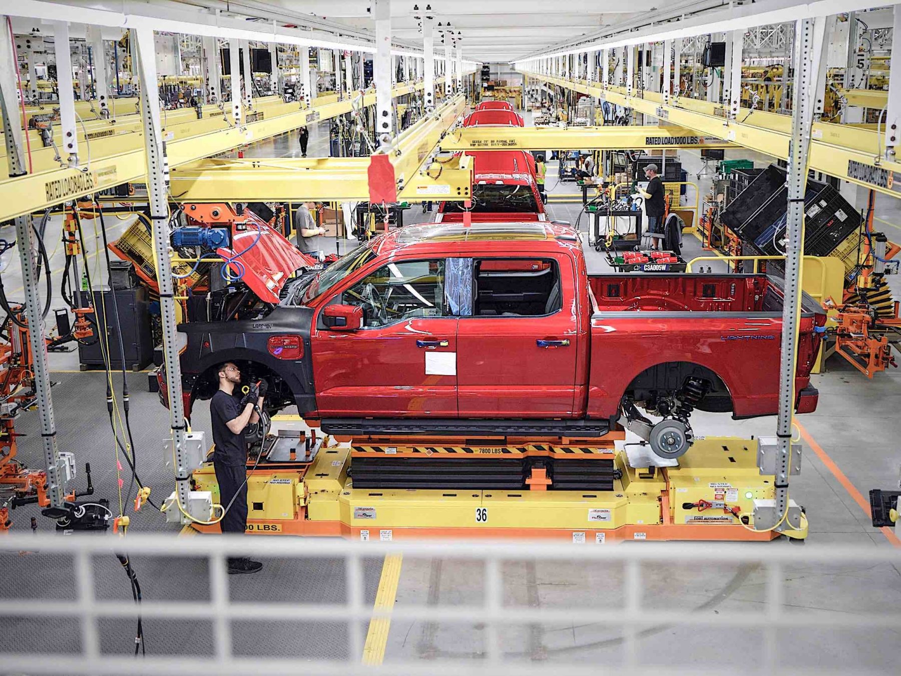 An assembly line creating Ford F-150 Lightning truccks.
