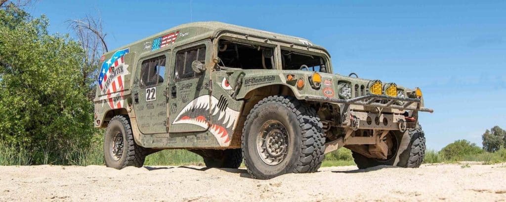 A Warfighter Made's Race Humvee on the sand.