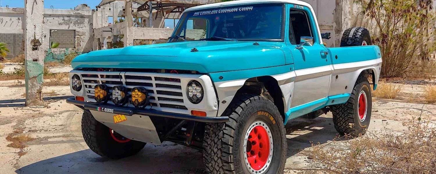 a blue and white Trophy Burro Bucking Ford F100