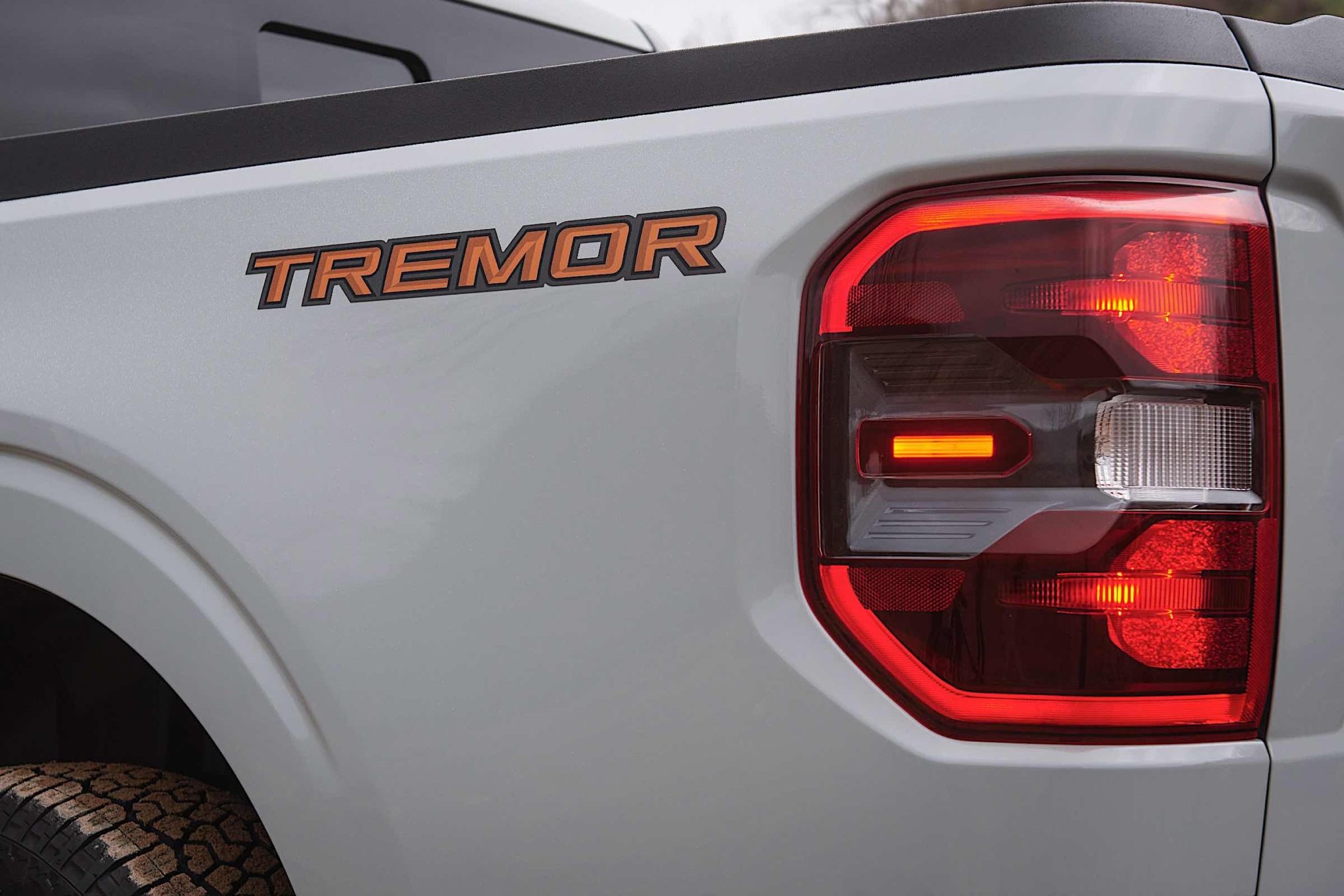 The rear tailight of a 2023 Ford Maverick truck.