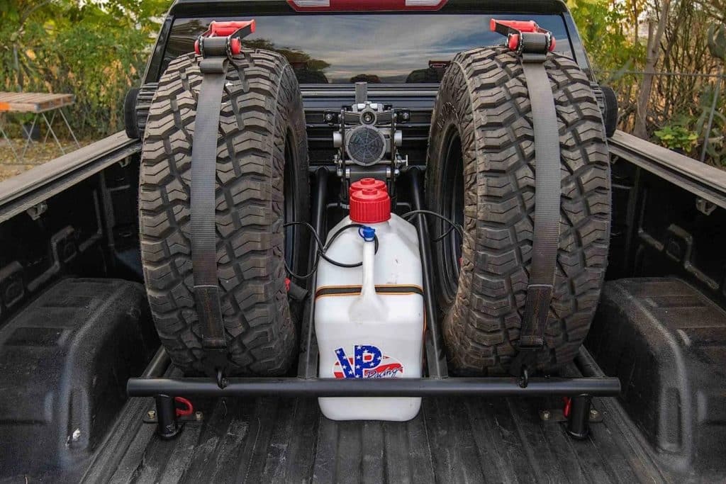 two tires in a tire rack.