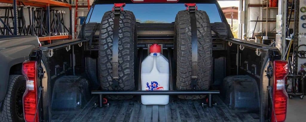 A tire rack in a truck bed.