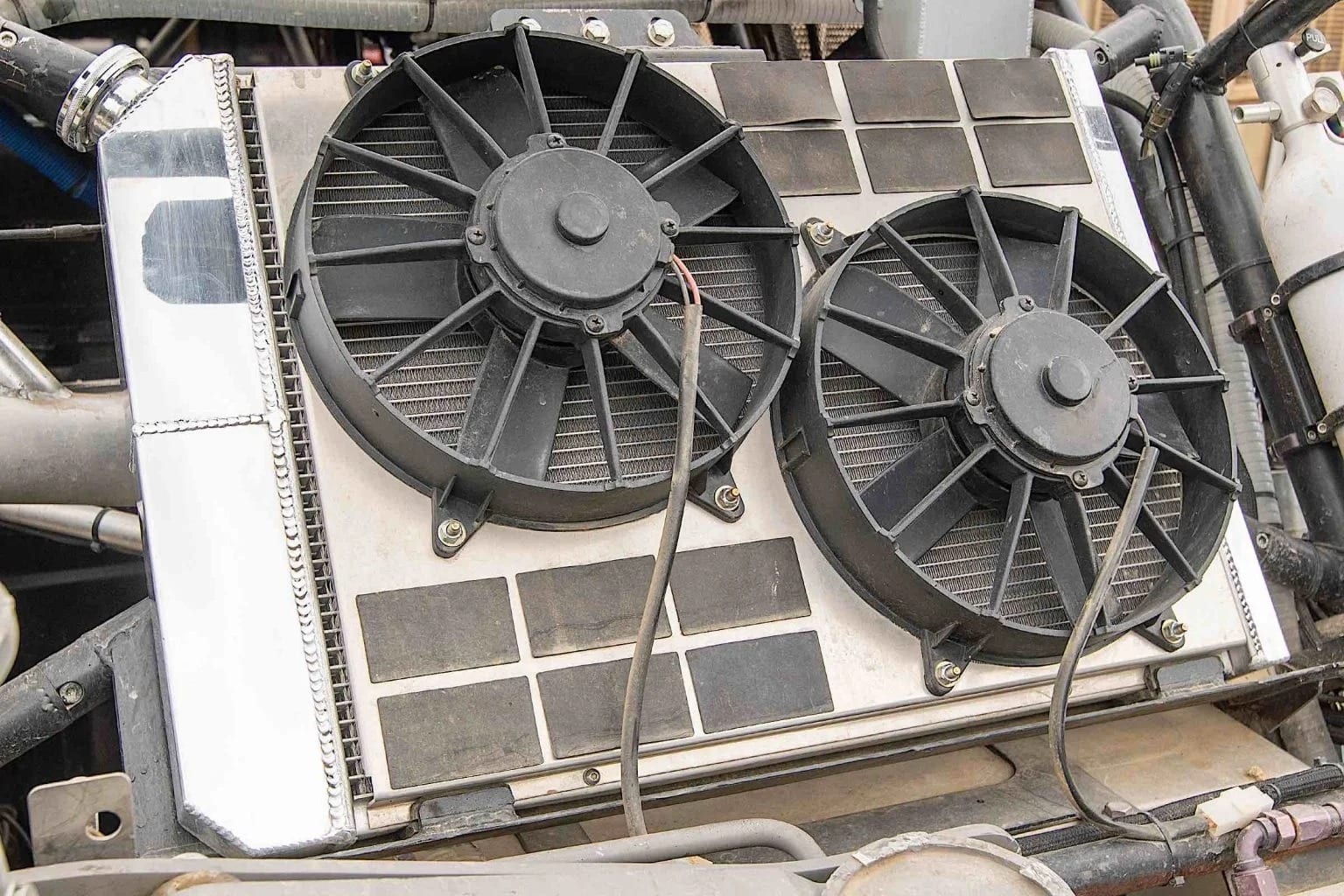 Two fans on a radiator mount.
