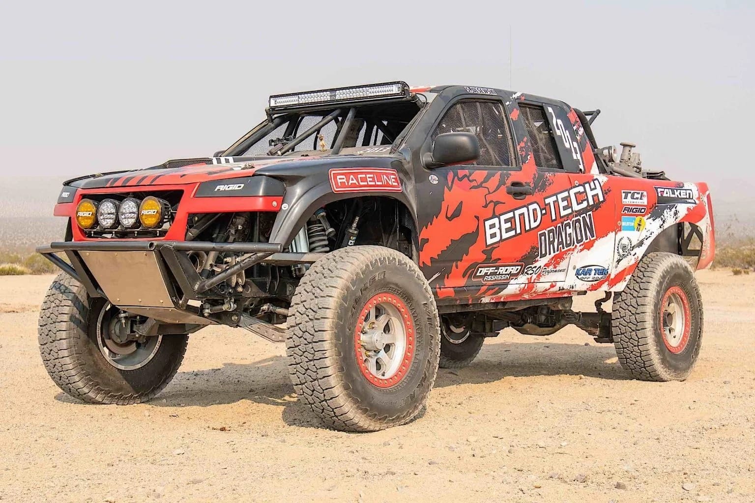 An off-road racing truck in the desert.