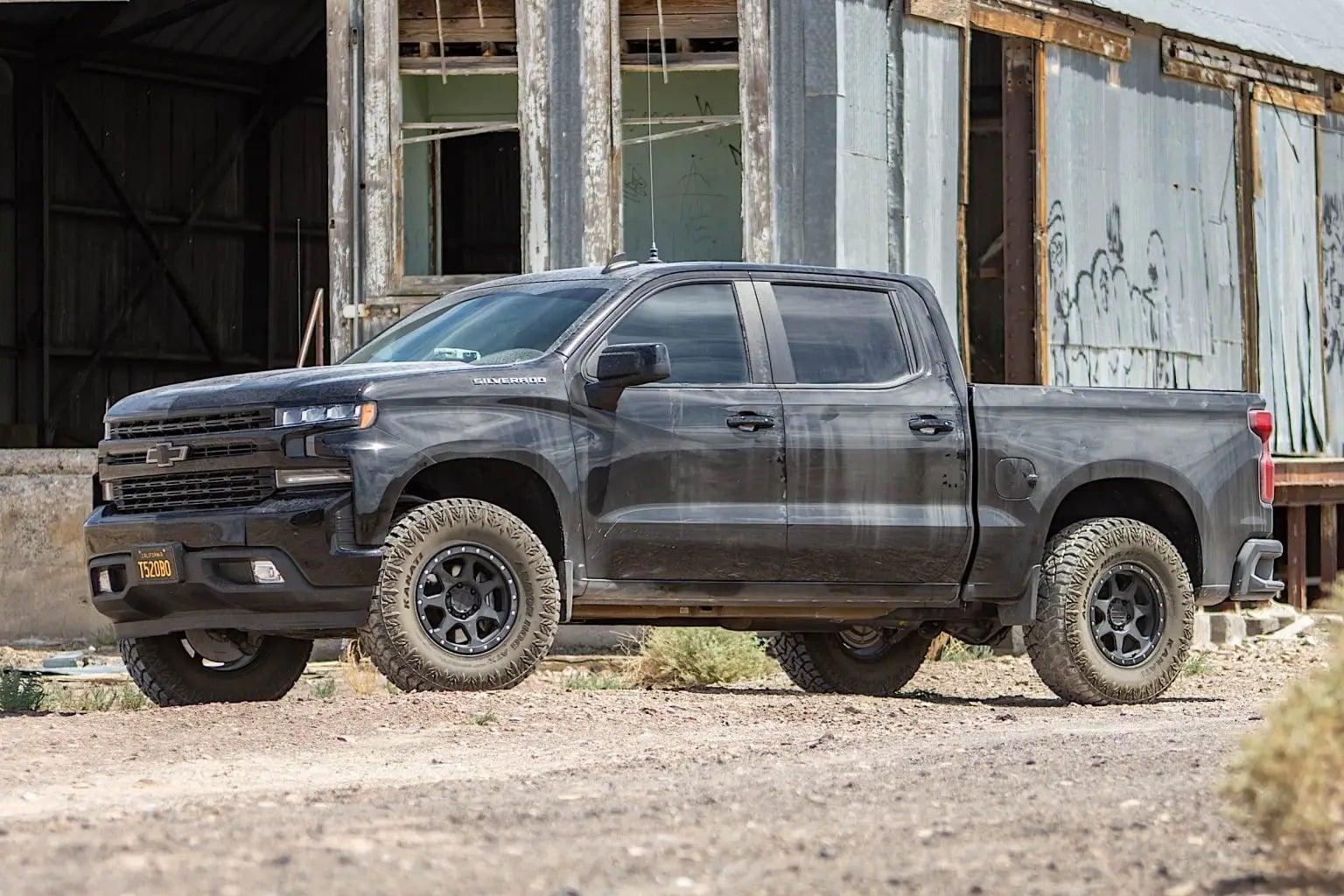 A 2019 Chevrolet Silverado covered in dirt and dust stains.