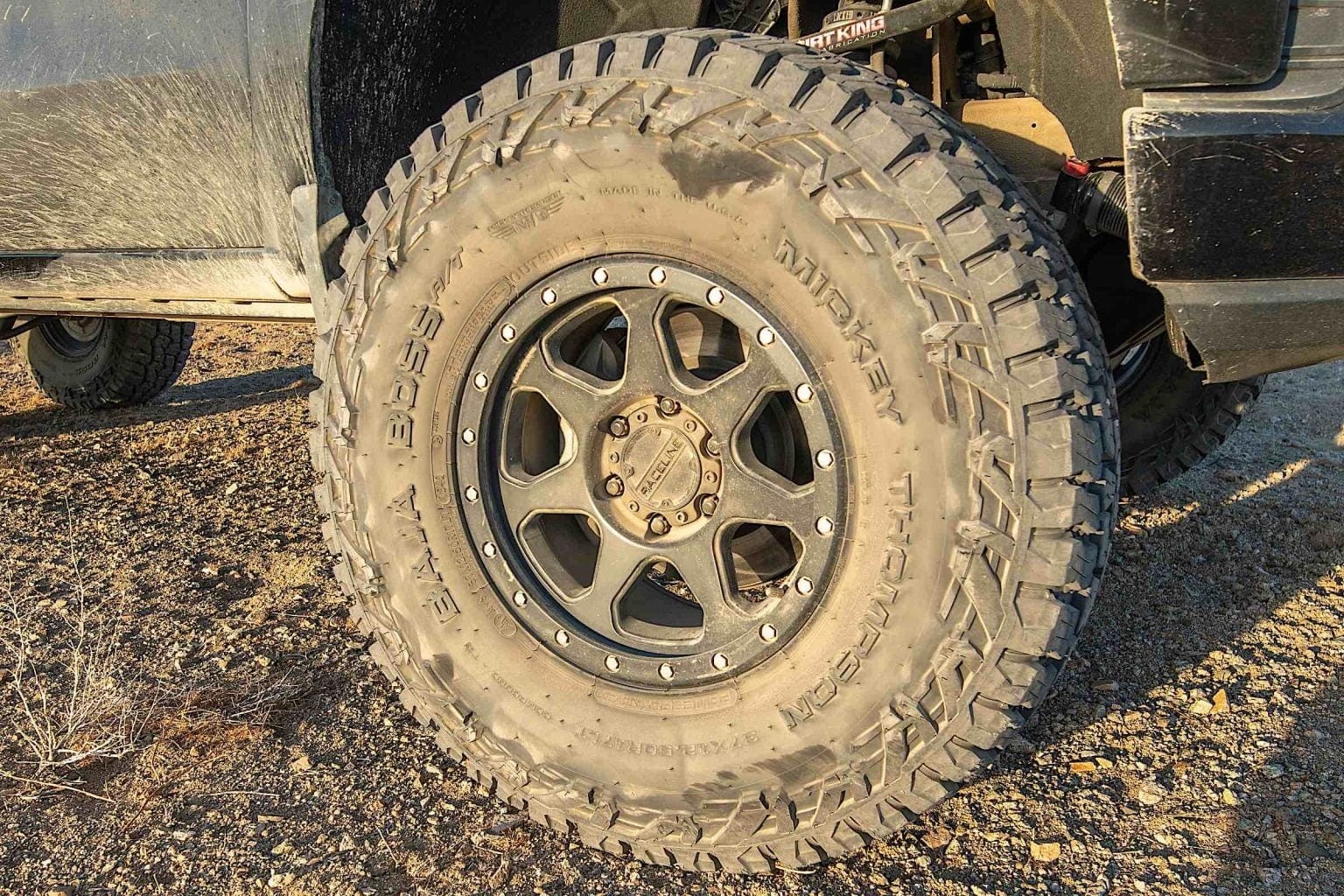 A dirt-covered Mickey Thompson Baja Boss tire.
