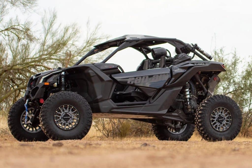 A 2020 Can-Am Maverick UTV on rocky terrain.