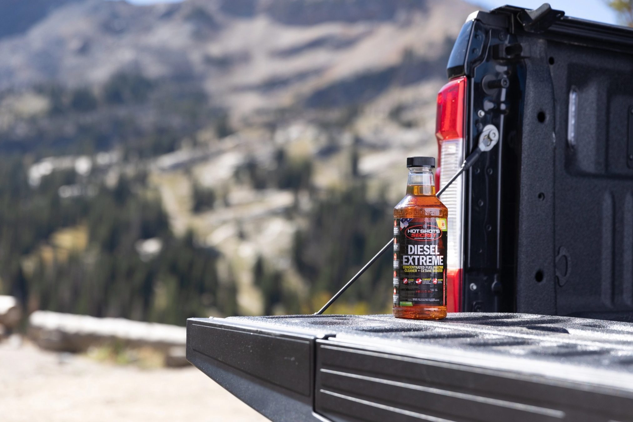 A can of diesel fuel injector on a truck tailgate.